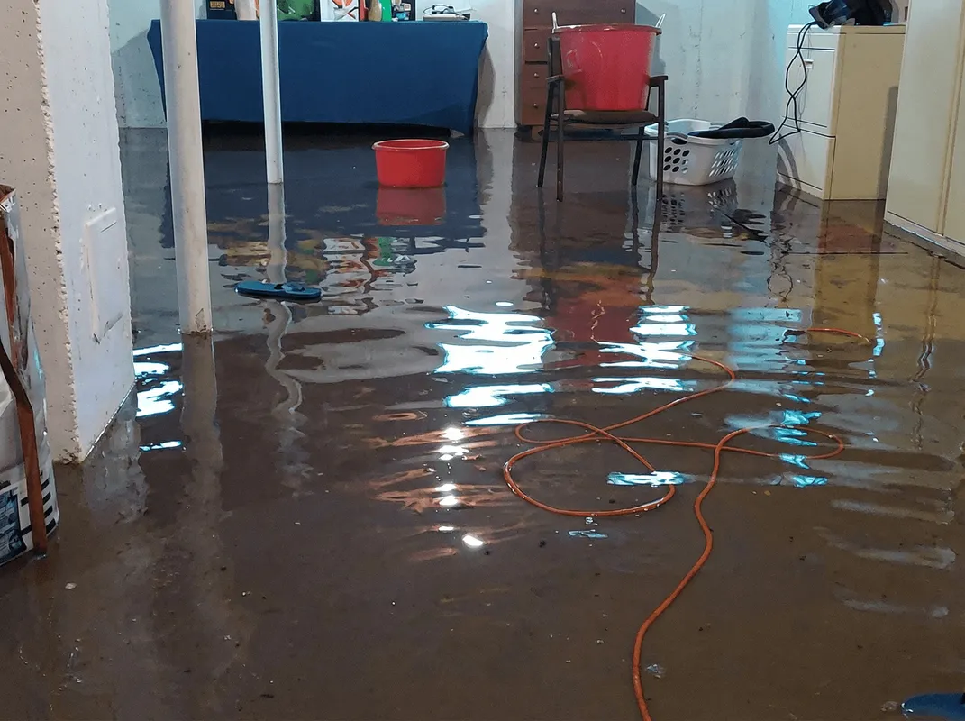 Basement with boiler, cabinets and washing machine completely flooded in Syracuse, NY
